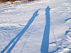 Late day skiing shadows