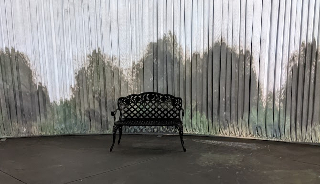 Ornate bench at immersive Monet art exhibit