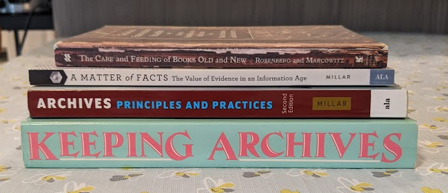 Pile of books related to keeping archives