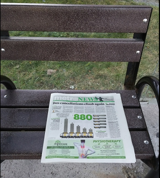 Metro Ottawa paper on bus stop bench
