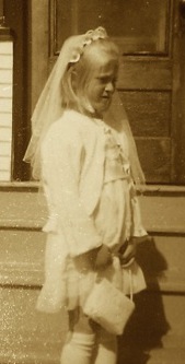 Little blonde girl after first communion