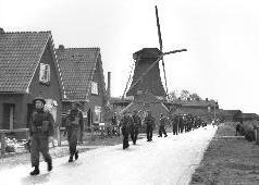 Troops of The Highland Light Infantry of Canada advancing in the central Netherlands