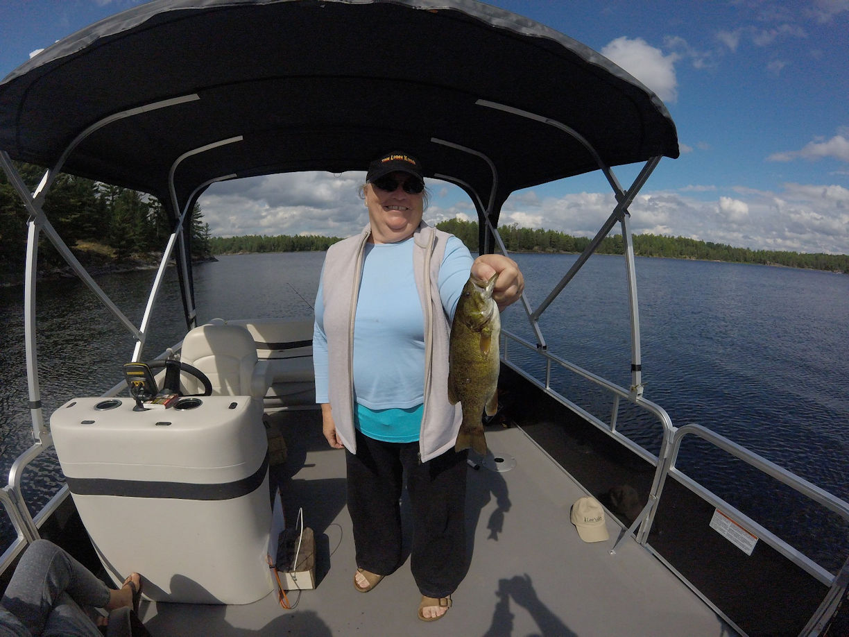 Grace with smallmouth bass, French River, Ontario, Canada