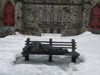 Homeless Jesus on bench sculpture