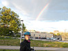 Lynn biking with a rainbow