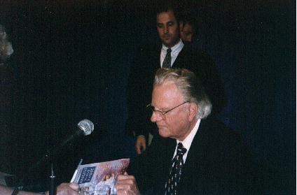 Billy Graham signs autograph