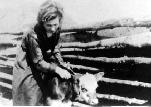 Teacher Gertie Rodin helping with farm chores, 1916